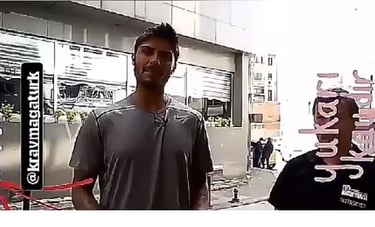 a man in a gray shirt and a man in a black shirt