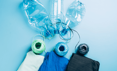 plastic bottle being recycled to fabric
