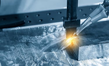a machine is cutting a piece of metal with a laser laser