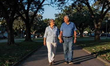 A photography of a joyful retired Latinoamericano couple walking hand-in-hand in a peaceful park during the golden hour. The composition is wide, showing trees and a stable environment. Palette of deep blue and soft light blue.