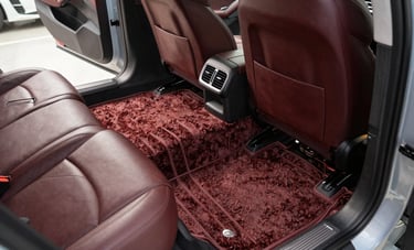 Professional photography of a showroom-ready car interior. The carpet is freshly extracted with perfect lines, and the leather seats look rich and conditioned. Modern North American aesthetic, bright daylight, emphasizing a sparkling perfection and premium finish.