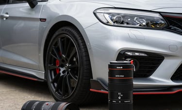 A detailed shot of professional mobile car detailing equipment alongside a gleaming silver performance car in a Brisbane residential driveway, high energy and premium feel.