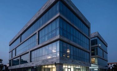 An wide-angle architectural shot of a minimalist, high-tech research center in an Indian urban setting. The scene features deep blue lighting and polished stone surfaces, evoking a sense of premium expert strategy.
