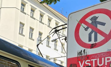 a bus stop sign on a city street