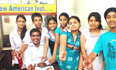 a group of people standing around a desk