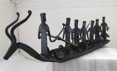 "Traditional Bastar forged iron boat with seven figures and deer head – left side view-Meant for export"