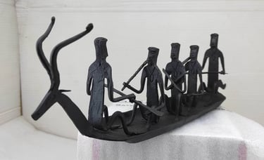 "Handcrafted tribal iron boat with 5 seated figures – Bastar Loha Shilp, left side view-Export-grade"