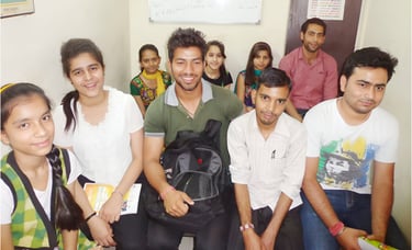 a group of people standing around a man in a backpack