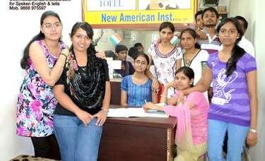 a group of people standing around a desk