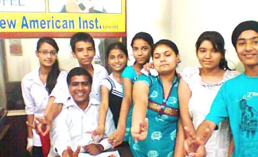 a group of people standing around a desk