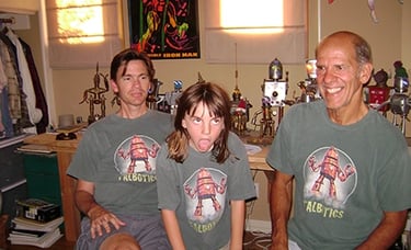 Three generations of family all wearing Talbotics t-shirts.