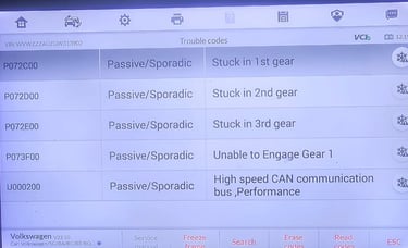 A car diagnostic scan tool displaying various Volkswagen trouble codes, including passive/sporadic errors like "Stuck in 1st