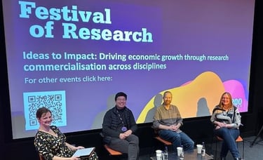 Strategic support for leaders designing new initatives. Image of panel at festival of research.