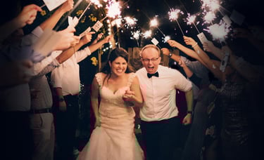 Glasgow wedding video—sparkler tunnel exit at night, candid moment.