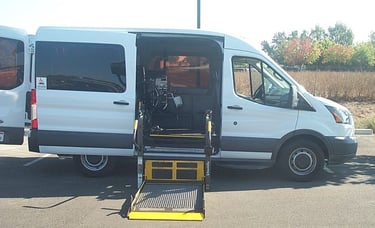 Side View of a Ford Transit Mid Roof with the BraunAbility Millennium Lift