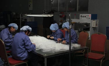 The workshop team is collaborating to complete production tasks
