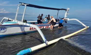 a man is getting ready to go out on a boat at lovina reef