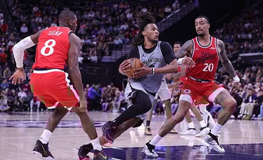 Stephon Castle of the Spurs controls the ball against Kris Dunn and John Collins of the Clippers
