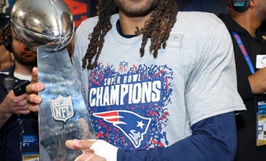 Stephon Gilmore holding the Lombardi Trophy following the Patriots victory of the Rams in Super Bowl LIII