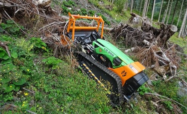 Green Climber LV 800 Pro Model clearing dense brush and logs up steep slope in forested area