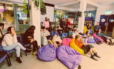 Attendees seated on bean bags during a post-screening discussion at Auckland International Film Club.