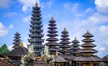 Besakih Temple gates made of black volcanic stone against a clear blue sky