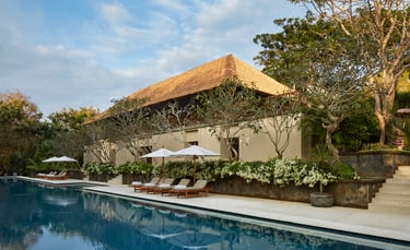 Luxury Aman Villa at Nusa Dua, Bali, featuring a private infinity pool, tropical garden, and modern Balinese architecture 