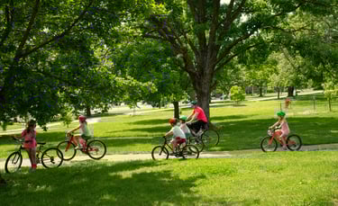 Group of children biking through the park
