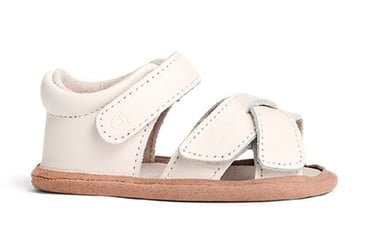 Product photography - a white baby's leather sandal with a strap