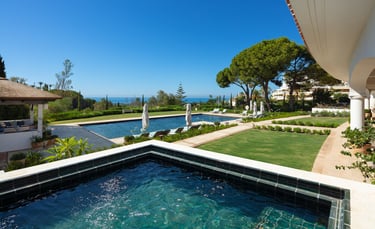 Garden, pool, and Mediterranean views from the pool house at Villa La Gratitud.