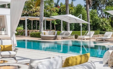 Luxury pool terrace with shaded lounges at Villa Serenity