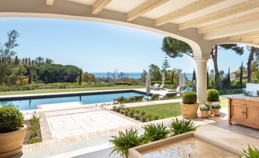 Terrace lounge at Villa La Gratitud with sea views and shaded pergola