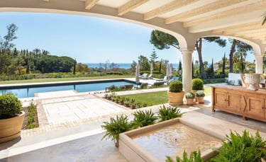 Terrace lounge at Villa La Gratitud with sea views and shaded pergola