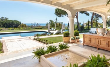 Terrace lounge at Villa La Gratitud with sea views and shaded pergola