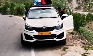 a car parked on a mountain side road