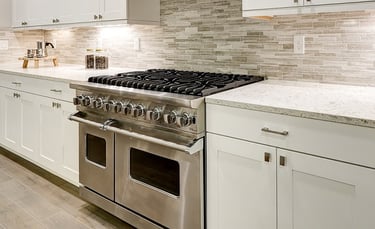 a kitchen with a stove top oven and a range hood