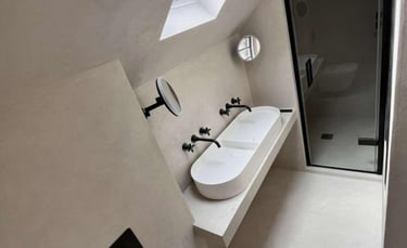 Fully tiled contemporary bathroom with bathtub and vanity unit fitted by PBP Services