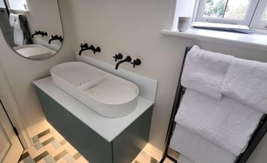stylish bathroom with double sinks and chrome mixer taps in Evesham