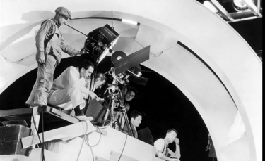 Berkeley and crew filming Judy Garland and Mickey Rooney’s “I Got Rhythm” with cowboy dancers.
