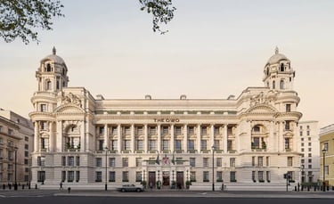 The grand facade of The Raffles OWO hotel in London, a luxurious heritage destination.