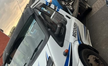 alt="Van loaded onto transport truck in Droitwich"