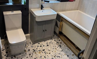 Completed bathroom showing expert second fix plumbing work in Pershore