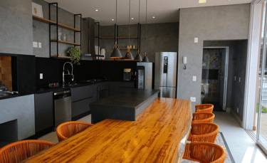 a kitchen with a wooden table and chairs