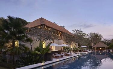 Luxury Aman Villa at Nusa Dua, Bali, featuring a private infinity pool, tropical garden, and modern Balinese architecture 