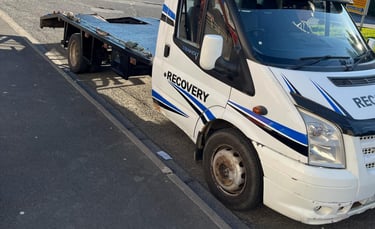alt="Non-runner van loaded onto recovery truck in Great Malvern"