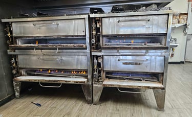 Appliance repair technician is repairing commercial oven Bakers Pride in Charlotte NC