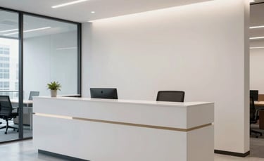 A modern and accessible office reception area in a North American / US city, clean lines, off-white and light gray colors, welcoming and professional atmosphere.