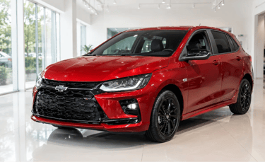 Chevrolet Onix LTZ vermelho em showroom moderno com piso claro e paredes de vidro