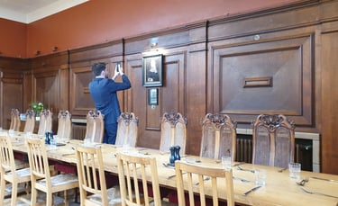 James Syrett photographs the portrait of Lady Margaret Beaufort at Lady Margaret Hall, Oxford