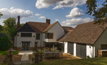 Modern extension to arts and crafts home. Conveys sympathetic design to original home.